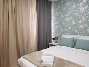 En eller flere senger på et rom på Martim Moniz Charming by Lisbon Village Apartments