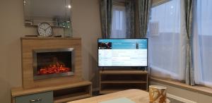 TV a/nebo společenská místnost v ubytování Bonnie Gorm