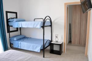 Postel nebo postele na pokoji v ubytování Sant Isidoro suite + 25 fotografií