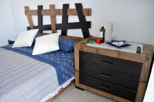 A bed or beds in a room at Sant Isidoro suite