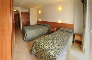 Postel nebo postele na pokoji v ubytování Hotel Alpen