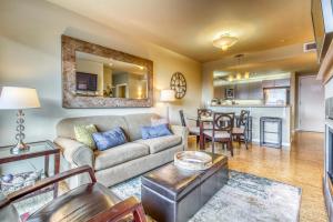 a living room with a couch and a table at Chelan Resort Suites: Water Sunset (#303) in Chelan