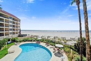 a view of the beach from the balcony of a resort at Seascape 218 in Isle of Palms