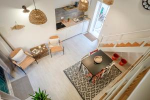 an overhead view of a kitchen and a living room at Fisherman's Inn Loft in Montijo