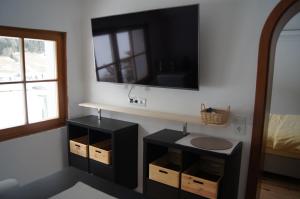 a bathroom with a sink and a mirror at Land - Haus in Pusterwald