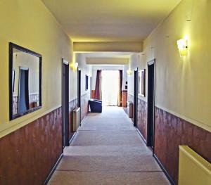 a hallway of a building with a long corridor at Cazare Karmina in Baia Mare
