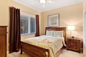 a bedroom with a bed and a dresser at Venus Lodges Condos in Gatlinburg
