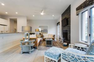 a living room with a couch and a fireplace at Ocean Winds 3023 in Seabrook Island