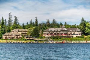 a large house on the shore of a lake at Painter's Lodge, Trademark Collection by Wyndham in Campbell River