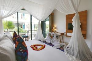 Tempat tidur dalam kamar di Sabana Ubud