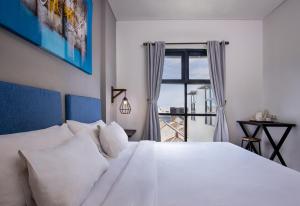 Postel nebo postele na pokoji v ubytování The Aswana Seminyak + 22 fotografií