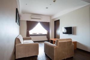 TV a/nebo společenská místnost v ubytování C'haya Hotel