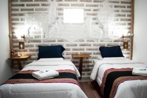 Postel nebo postele na pokoji v ubytování Hotel Sal Andina