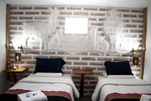 Postel nebo postele na pokoji v ubytování Hotel Sal Andina