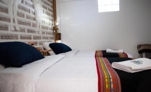 Postel nebo postele na pokoji v ubytování Hotel Sal Andina