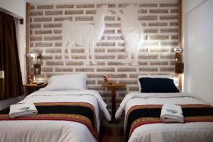 Postel nebo postele na pokoji v ubytování Hotel Sal Andina