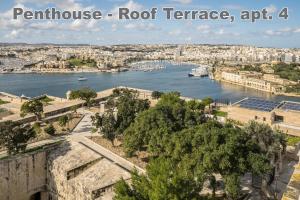 a view of the river seine and a city at Valletta Hastings Suites in Valletta