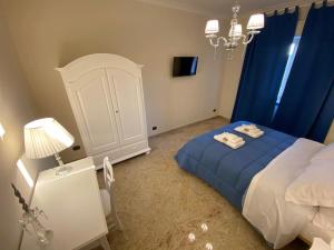 Postel nebo postele na pokoji v ubytování B&B San Michele Foggia