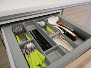 a drawer filled with utensils in a kitchen at I City Residence, 2 Bedroom 4-6 Pax unit, Walking to Theme n Water Park & Shopping Mall in Shah Alam