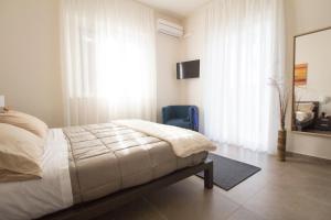 Ένα ή περισσότερα κρεβάτια σε δωμάτιο στο Casa di Sara +48 φωτογραφίες