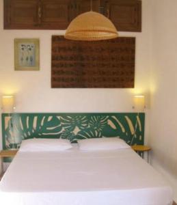 Giường trong phòng chung tại Casa Baia
