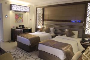 Katil atau katil-katil dalam bilik di Tio Sea Resort