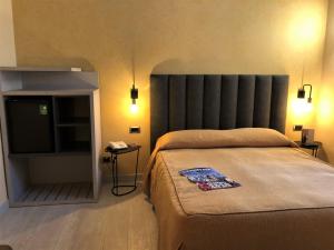 Postel nebo postele na pokoji v ubytování Hotel Tirrenia
