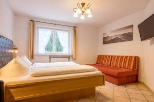 Postel nebo postele na pokoji v ubytování Landhaus Almrausch