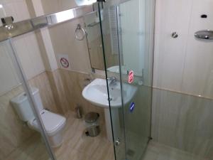 a bathroom with a toilet and a glass shower at HELEN in Artemida +14 photos