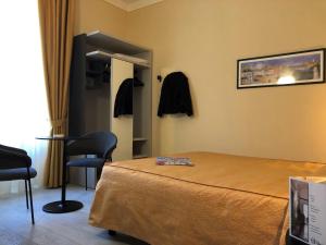 Postel nebo postele na pokoji v ubytování Hotel Tirrenia