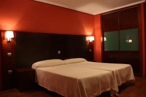 Postel nebo postele na pokoji v ubytování Hotel Tremazal