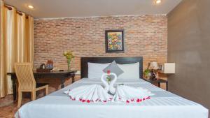 Best Central Point Hotel客房内的一张或多张床位