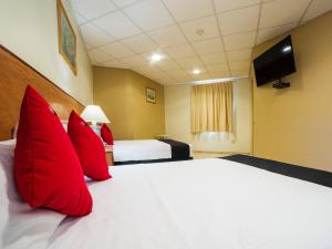 Postel nebo postele na pokoji v ubytování Hotel Zadapi
