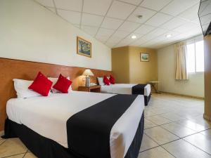 Postel nebo postele na pokoji v ubytování Hotel Zadapi
