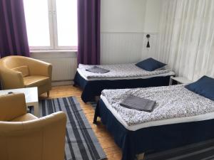 Tempat tidur dalam kamar di Gävle Bed & Breakfast