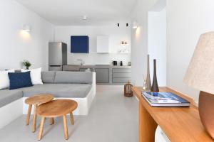 a living room with a couch and a table at Thiro Santorini in Fira