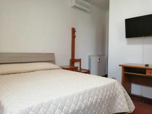 Casa per Ferie Ulivo d'Assisi客房内的一张或多张床位