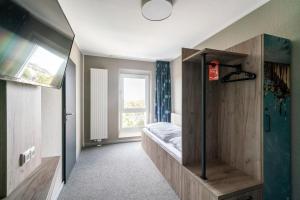 a room with a bed and a window at WIROtel Warnemünde in Warnemünde +37 photos