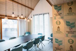a conference room with a long table and chairs at The Roastery in De Haan