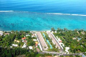 an aerial view of a resort next to the ocean at Sunset Beach Carlton- Tahiti - beachfront luxury residence & pool - 4 pers in Punaauia