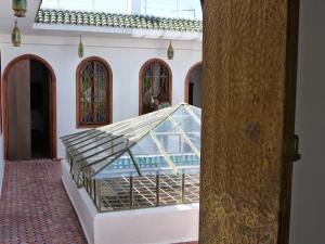 a glass tent in the middle of a building at Riad Tetuanía in Tétouan