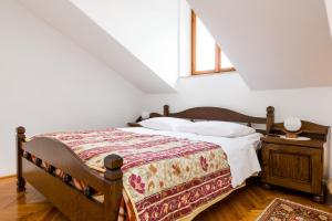 a bedroom with a bed and a window and a table at Villa Kukuljica in Zaton