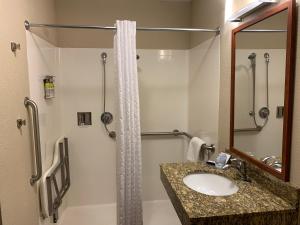 a bathroom with a sink and a shower at Candlewood Suites Jonesboro by IHG in Jonesboro +18 photos