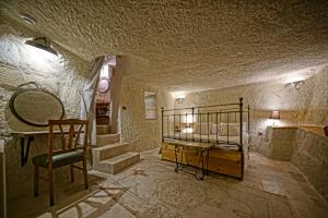 Postel nebo postele na pokoji v ubytování Naraca Cave House
