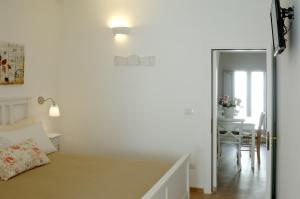 Postel nebo postele na pokoji v ubytování Carpe Diem B&B e Case Vacanza