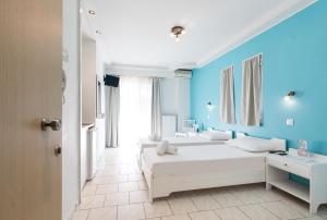 Postel nebo postele na pokoji v ubytování Hotel Melissanthi
