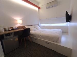 Ένα ή περισσότερα κρεβάτια σε δωμάτιο στο HQ Hostel Silom