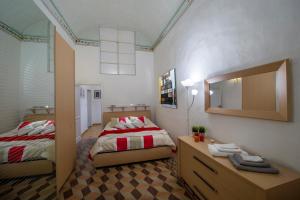 Säng eller sängar i ett rum på Casa In Piazza