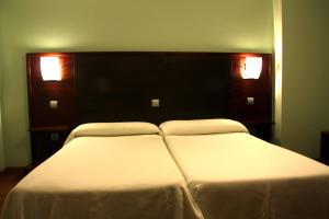 Postel nebo postele na pokoji v ubytování Hotel Tremazal