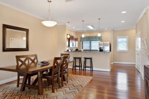a kitchen with a table, chairs and a refrigerator at Venus Lodges Condos in Gatlinburg